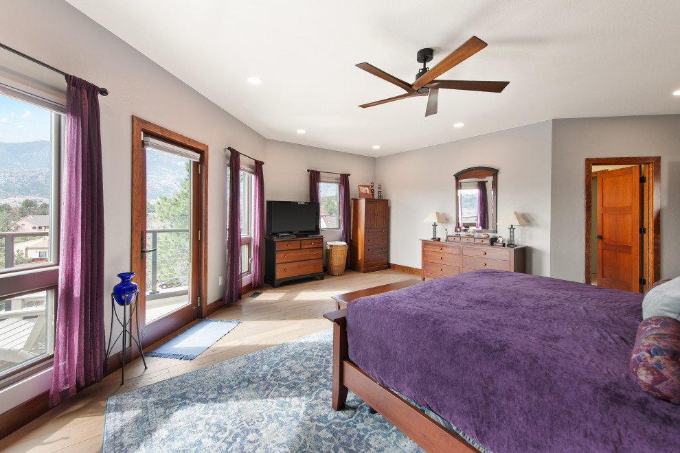 Example of a transitional bedroom design in Denver