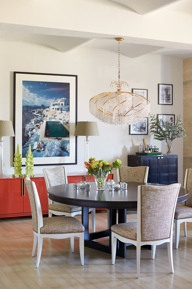 Inspiration for a transitional dining room in New York with white walls and light hardwood floors.