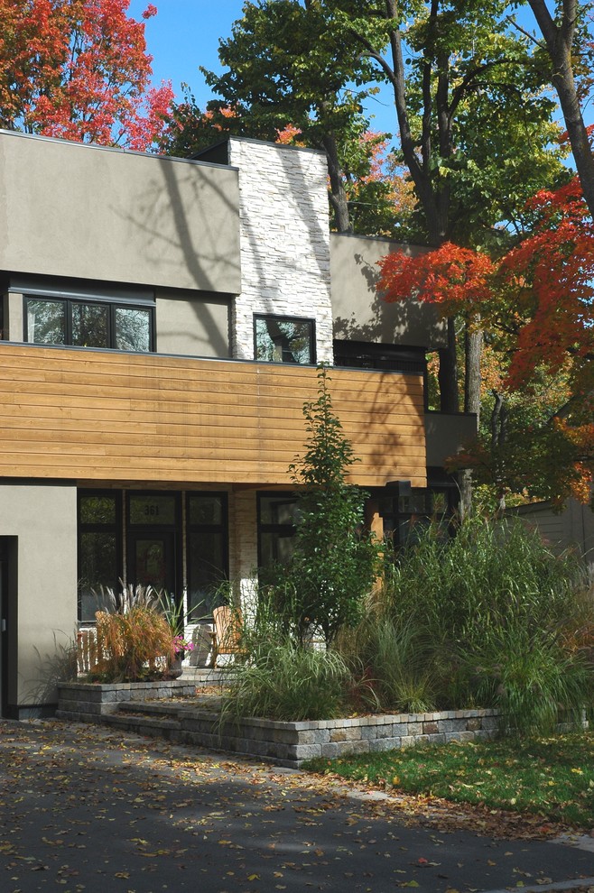 Design ideas for a contemporary exterior in Ottawa with stone veneer.