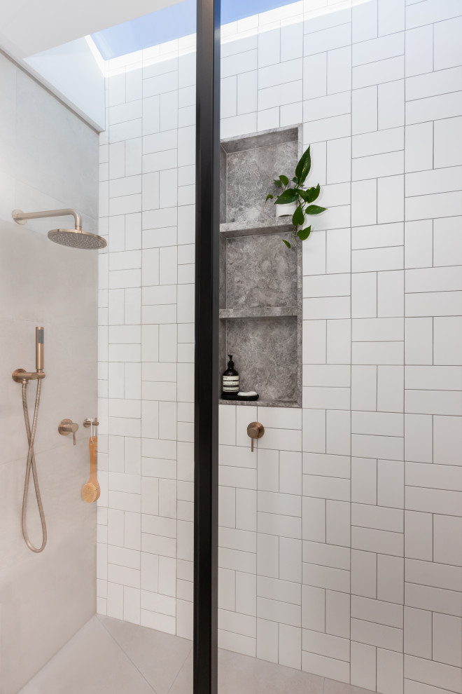 Small contemporary bathroom in Melbourne with recessed-panel cabinets, white cabinets, an open shower, a wall-mount toilet, multi-coloured tile, ceramic tile, grey walls, porcelain floors, an undermount sink, marble benchtops, grey floor, an open shower, grey benchtops, a niche, a single vanity and a floating vanity.