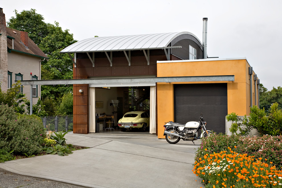 Inspiration for a mid-sized industrial attached two-car garage in Seattle.