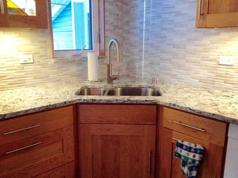 Inspiration for a mid-sized transitional u-shaped medium tone wood floor enclosed kitchen remodel with an undermount sink, shaker cabinets, dark wood cabinets, granite countertops, gray backsplash, stone tile backsplash, white appliances and no island