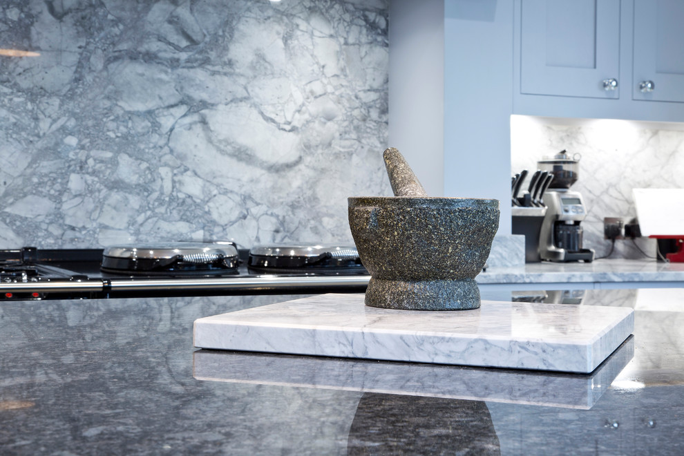 Inspiration for a large transitional u-shaped separate kitchen in Kent with a drop-in sink, shaker cabinets, granite benchtops, grey splashback, stone slab splashback and with island.