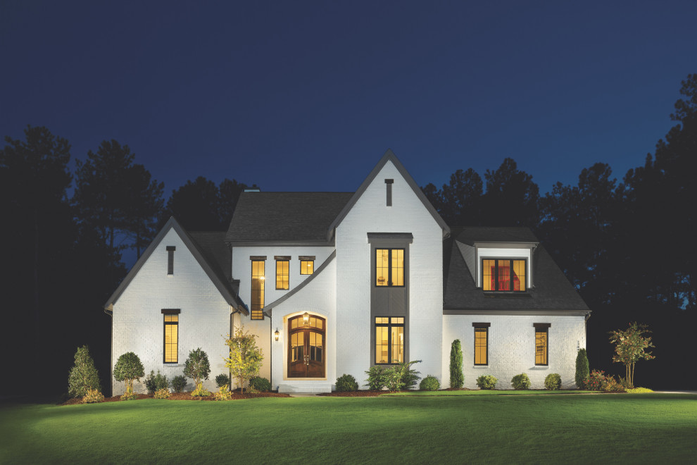 Photo of an expansive country two-storey brick house exterior in Nashville.