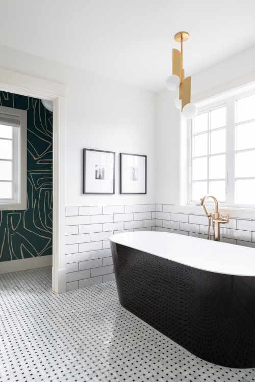 Large Subway Tile Bathroom with Black Tub and Brass Details