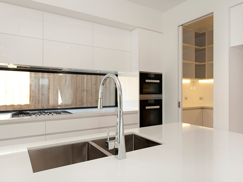 Design ideas for a contemporary kitchen in Melbourne with a double-bowl sink.