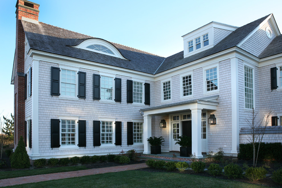 This is an example of a traditional three-storey exterior in Philadelphia with wood siding.