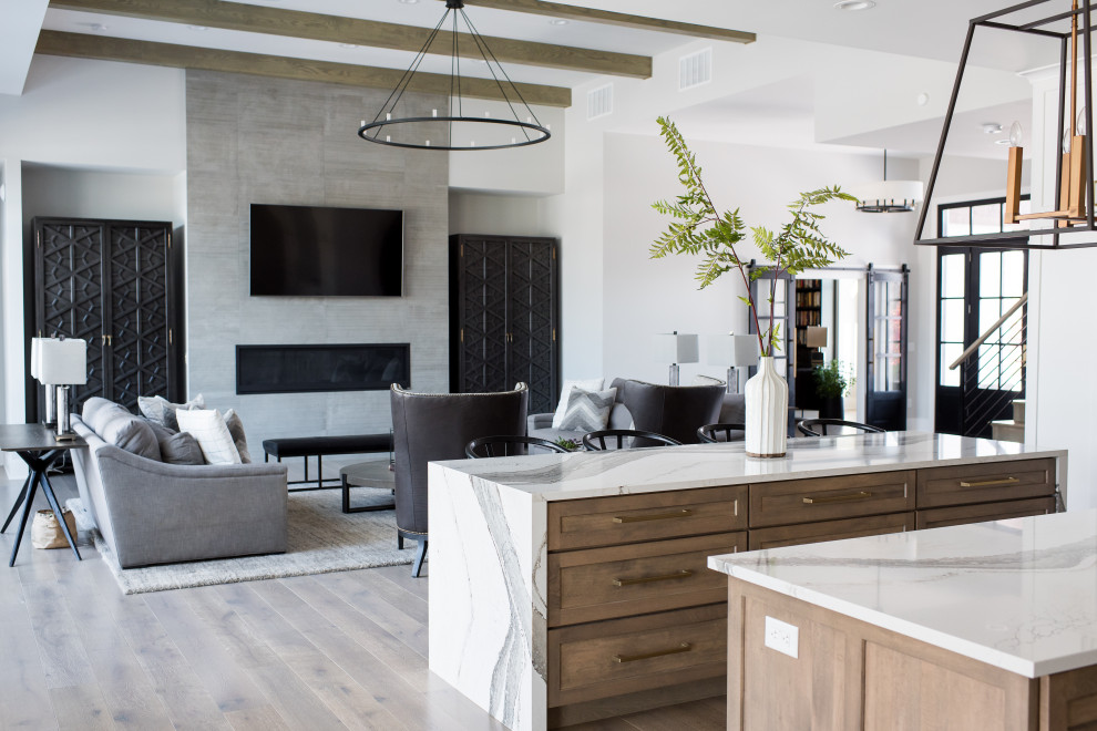 Inspiration for a mid-sized modern u-shaped open plan kitchen in Indianapolis with an undermount sink, shaker cabinets, grey cabinets, granite benchtops, stainless steel appliances, dark hardwood floors, with island and white benchtop.