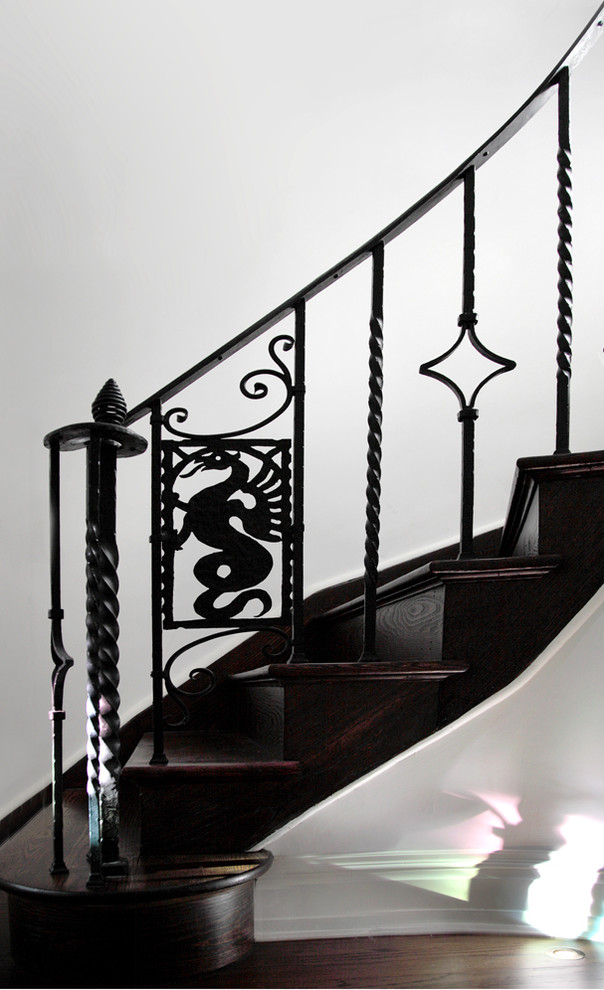 Design ideas for a mid-sized transitional wood curved staircase in New York with metal risers.