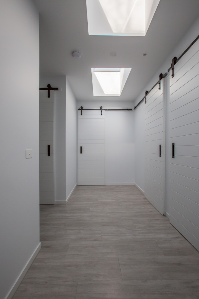 Expansive modern hallway in Melbourne with white walls.
