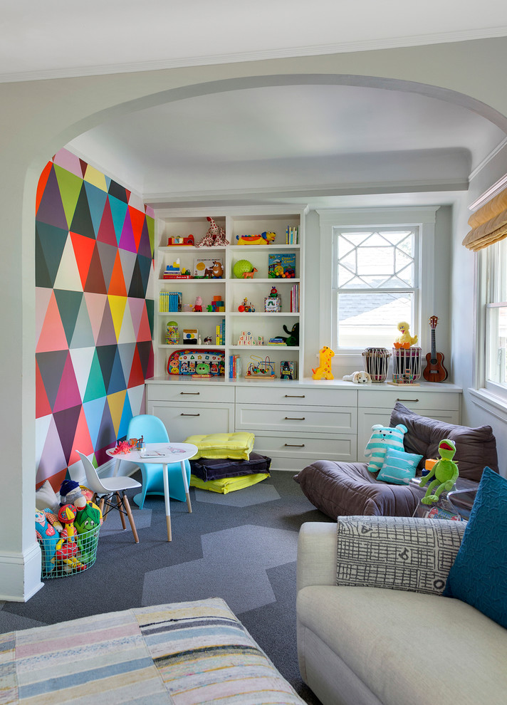 Photo of a transitional gender-neutral kids' playroom in Minneapolis with carpet and multi-coloured walls.