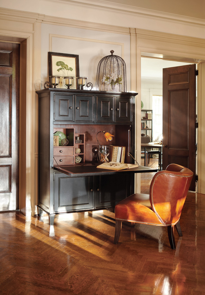 Inspiration for a traditional home office in Cleveland with white walls, dark hardwood floors and a freestanding desk.