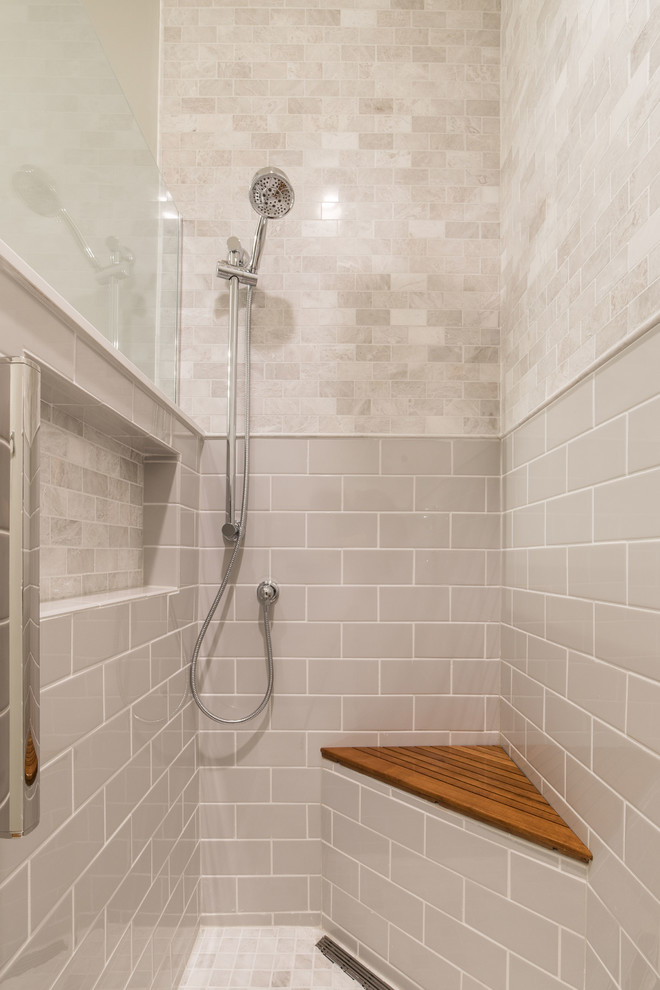 Photo of a mid-sized traditional 3/4 bathroom in Chicago with shaker cabinets, grey cabinets, a curbless shower, a two-piece toilet, ceramic tile, grey walls, ceramic floors, an integrated sink, marble benchtops, grey floor, an open shower and white benchtops.