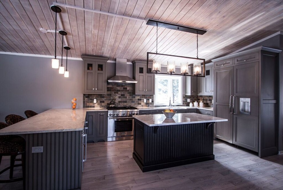 Inspiration for a mid-sized transitional u-shaped light wood floor eat-in kitchen remodel in Chicago with a farmhouse sink, flat-panel cabinets, green cabinets, quartzite countertops, multicolored backsplash, stone tile backsplash, paneled appliances and an island