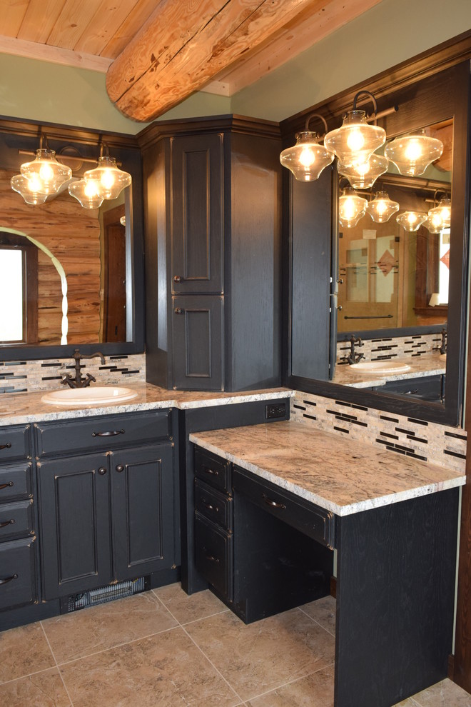 Mountain style mosaic tile bathroom photo with furniture-like cabinets, distressed cabinets and granite countertops