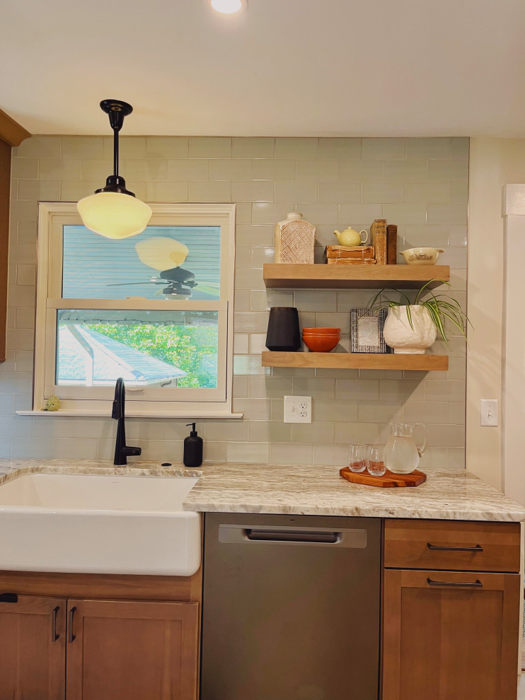 Eat-in kitchen - mid-sized transitional l-shaped vinyl floor and beige floor eat-in kitchen idea with a farmhouse sink, shaker cabinets, medium tone wood cabinets, quartzite countertops, green backsplash, ceramic backsplash, stainless steel appliances, no island and beige countertops