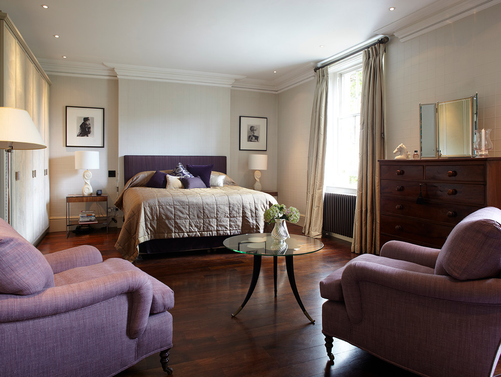 Photo of a traditional master bedroom in Sussex with grey walls and dark hardwood floors.