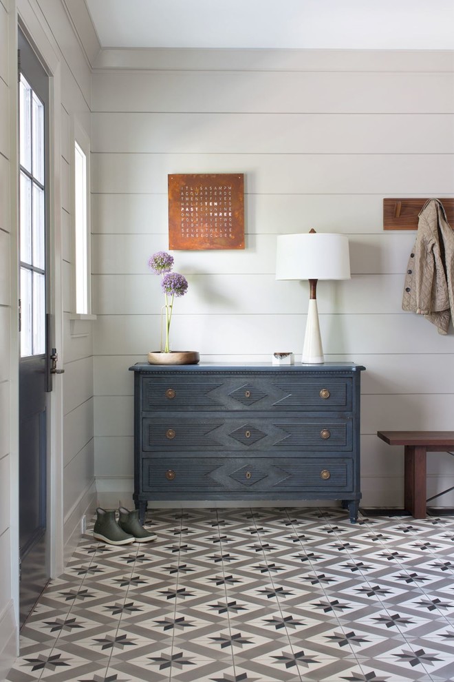 Inspiration for a mid-sized transitional ceramic tile and white floor mudroom remodel with gray walls and a blue front door