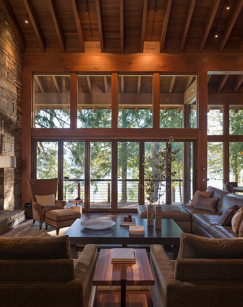 Inspiration for a contemporary family room in Seattle with a stone fireplace surround.