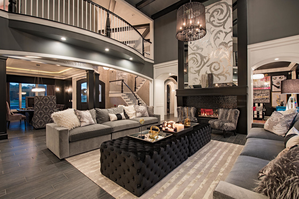 Inspiration for an expansive transitional formal enclosed living room in Cleveland with a tile fireplace surround, black walls, vinyl floors, a ribbon fireplace, no tv and black floor.