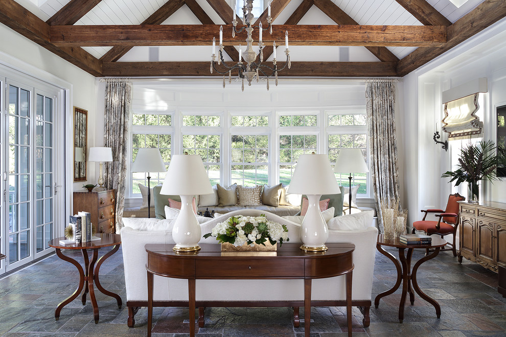 Example of a large eclectic slate floor and gray floor sunroom design in New York with no fireplace