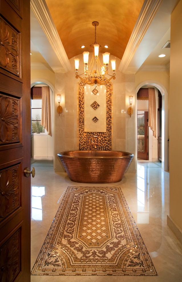 Design ideas for a large mediterranean master bathroom in Miami with marble benchtops, a freestanding tub, a shower/bathtub combo, multi-coloured tile, mosaic tile, beige walls and marble floors.