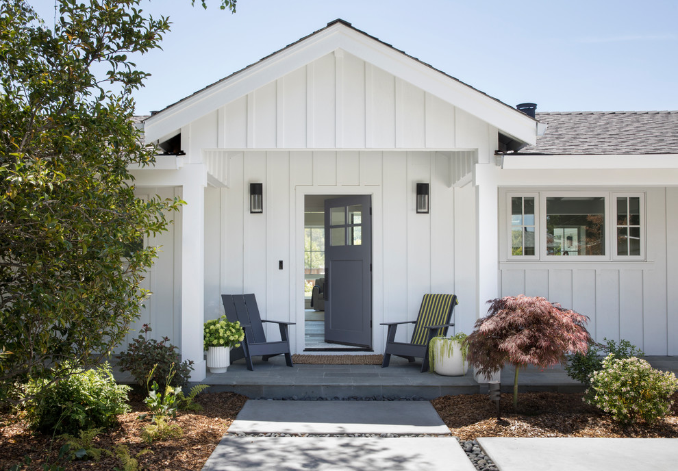 Mid-sized country front door in San Francisco with white walls, slate floors, a single front door, a blue front door and blue floor.