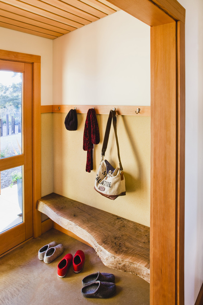 Photo of a country mudroom in San Francisco with beige walls, a single front door and a glass front door.
