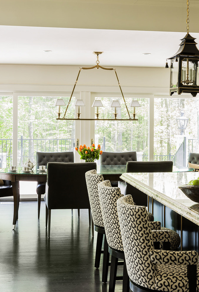 This is an example of an expansive transitional dining room in Manchester.