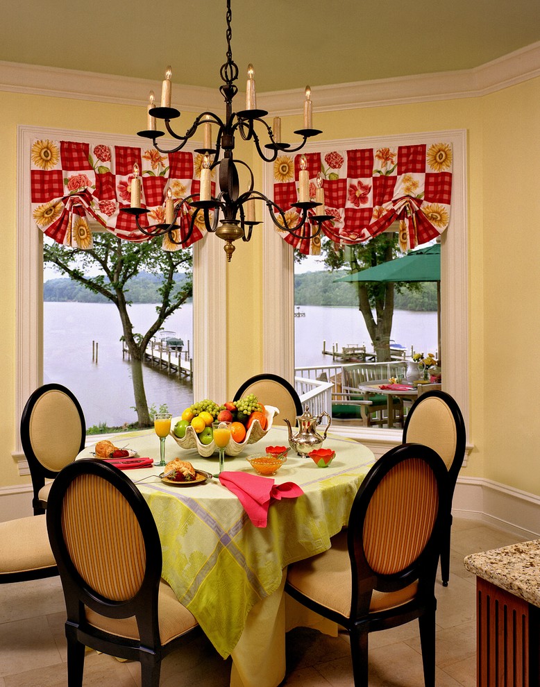 Design ideas for a traditional dining room in Miami with yellow walls.