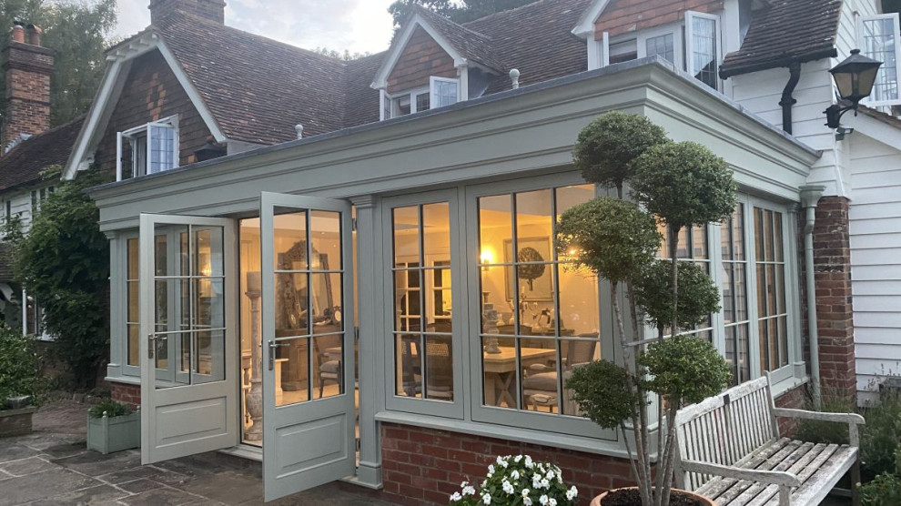 Example of a large classic sunroom design in Kent