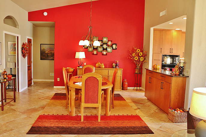 Inspiration for a mid-sized mediterranean open plan dining in Phoenix with orange walls and ceramic floors.