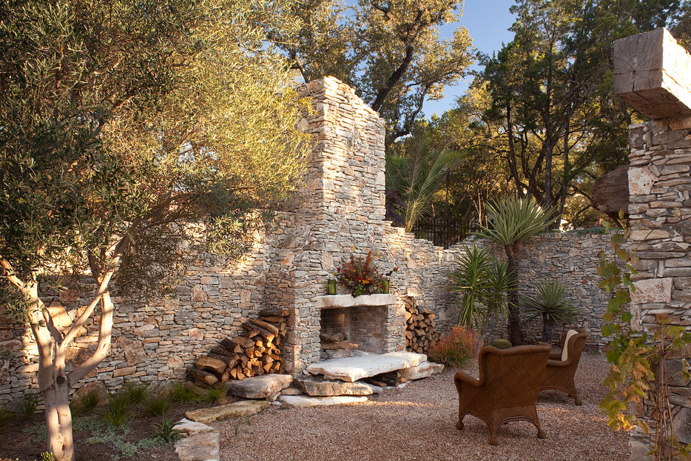 Inspiration for a country patio in Austin with a fire feature.