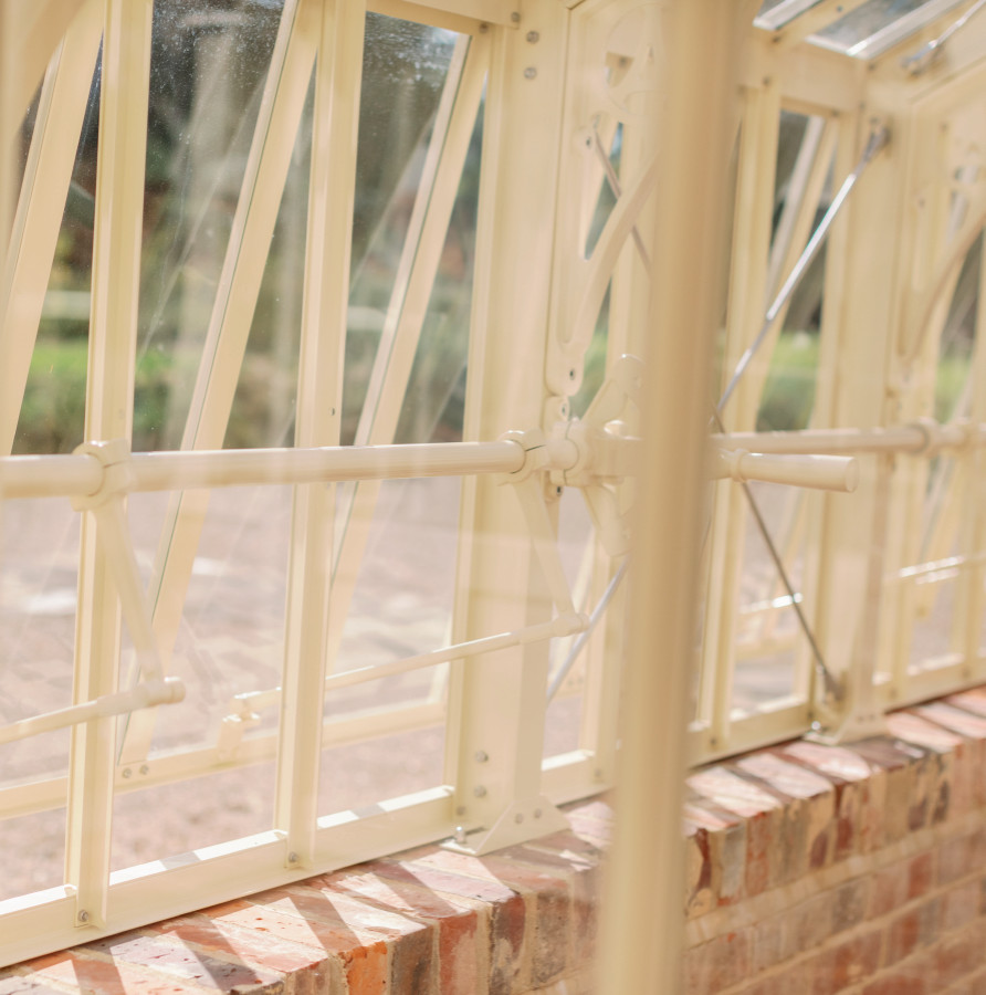This is an example of an expansive traditional attached greenhouse in Surrey.