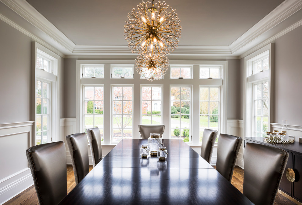 This is an example of a traditional dining room in New York with medium hardwood floors.
