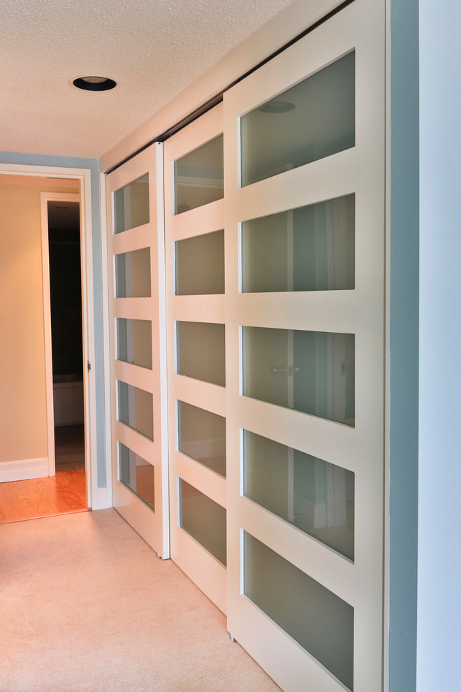 This is an example of a contemporary storage and wardrobe in Ottawa.
