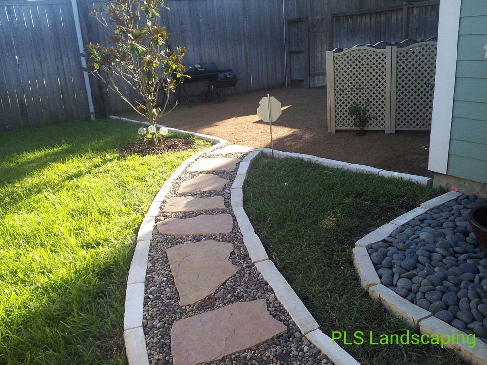 Design ideas for a desert look traditional backyard xeriscape in Houston.
