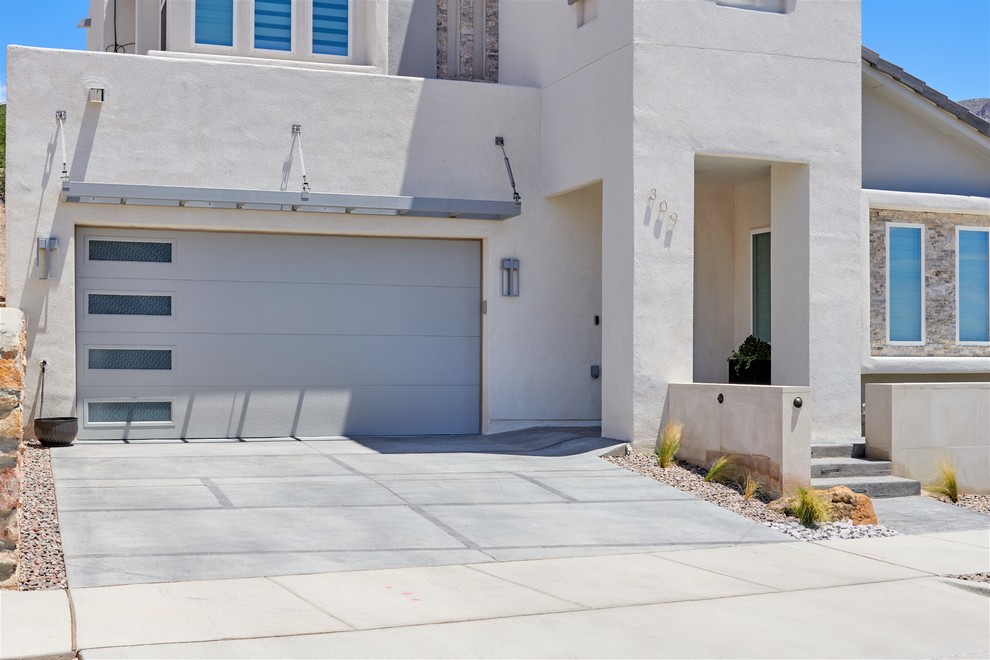 Inspiration for a small drought-tolerant front yard concrete paver garden path.