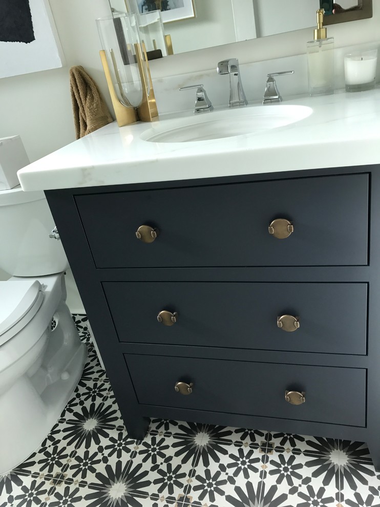 This is an example of a small midcentury 3/4 bathroom in Sacramento with flat-panel cabinets, grey cabinets, a two-piece toilet, white walls, mosaic tile floors, an undermount sink, marble benchtops and grey floor.