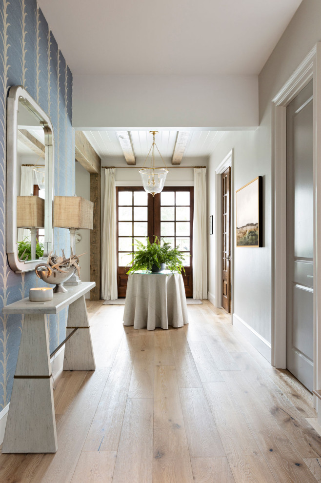 Design ideas for a large contemporary entry hall in Orlando with blue walls, medium hardwood floors, a double front door, a brown front door and brown floor.