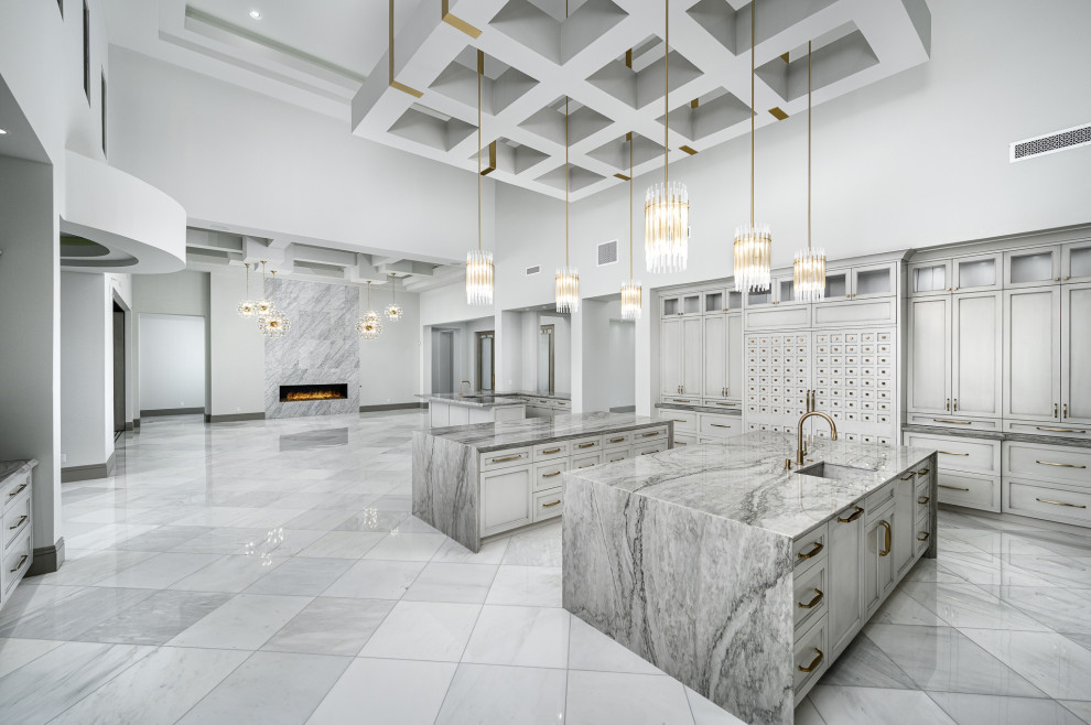 Kitchen - huge modern u-shaped marble floor, gray floor and coffered ceiling kitchen idea in Phoenix with a drop-in sink, gray cabinets, marble countertops, colored appliances, two islands and gray countertops