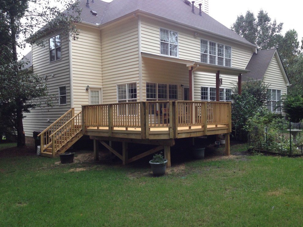 Photo of a mid-sized traditional backyard deck in Raleigh with no cover.