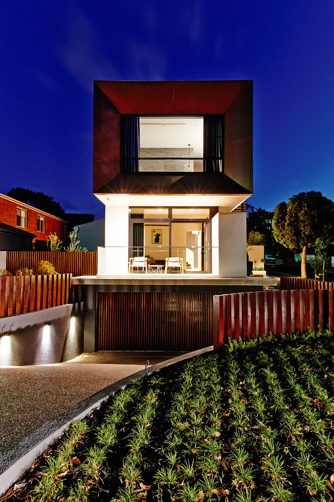 Photo of a large contemporary two-storey house exterior in Melbourne with a flat roof.