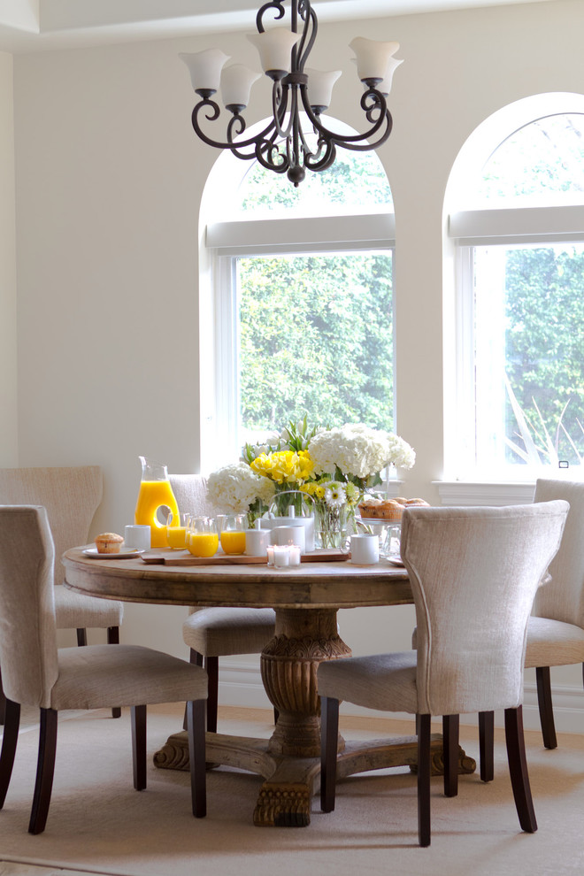 Photo of a traditional dining room in Los Angeles with beige walls.