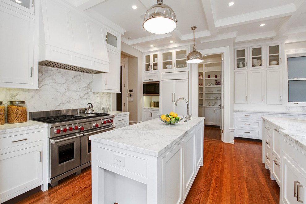 Inspiration for an expansive transitional galley separate kitchen in San Francisco with a single-bowl sink, shaker cabinets, white cabinets, white splashback, stainless steel appliances, medium hardwood floors, with island, marble benchtops, marble splashback and beige floor.
