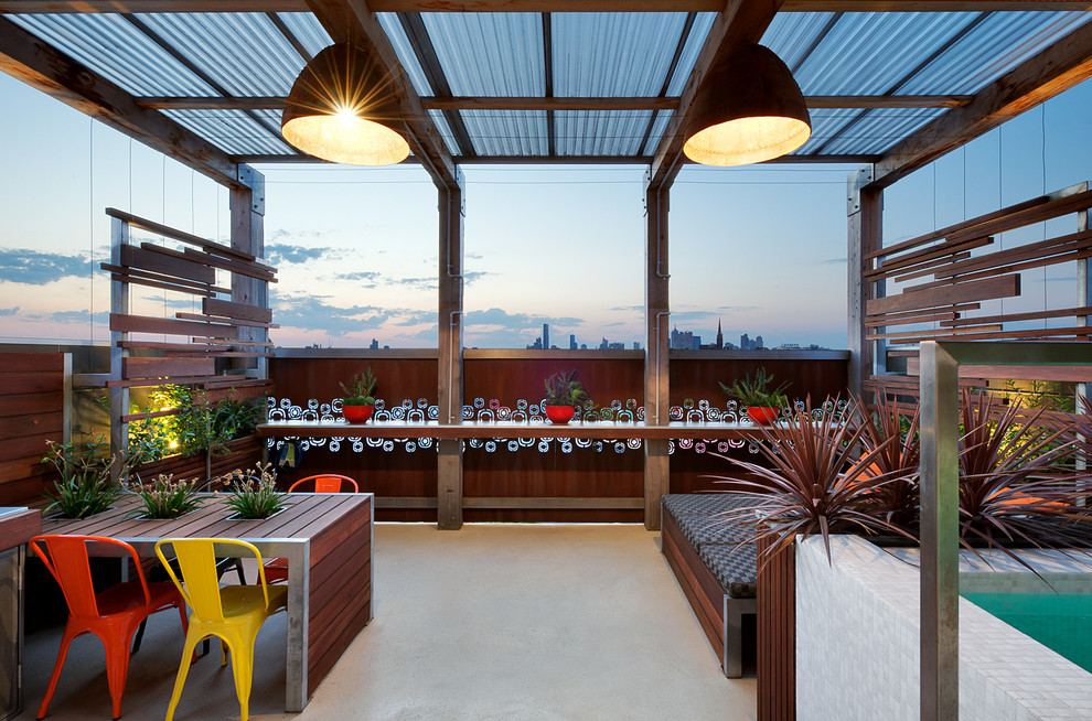 Design ideas for a contemporary rooftop and rooftop deck in Other with a pergola.