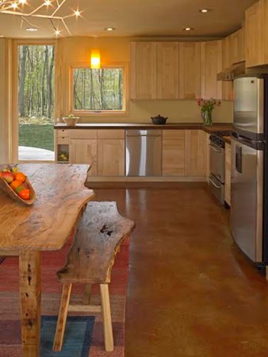 Inspiration for a large rustic l-shaped concrete floor and brown floor eat-in kitchen remodel in Providence with shaker cabinets, light wood cabinets, stainless steel appliances and no island