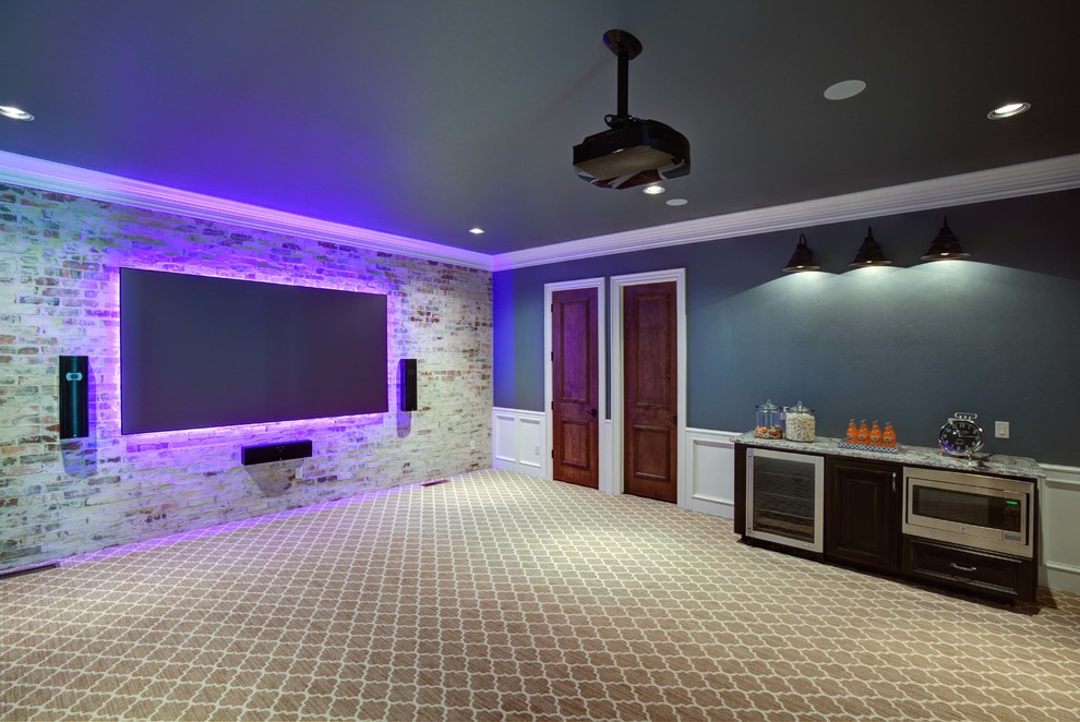 This is an example of a large transitional enclosed home theatre in Oklahoma City with blue walls, carpet and a wall-mounted tv.