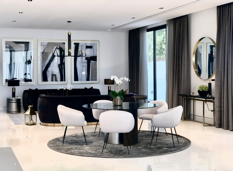 Foto di un ampio soggiorno chic aperto con sala formale, pavimento in marmo, pavimento bianco e pannellatura