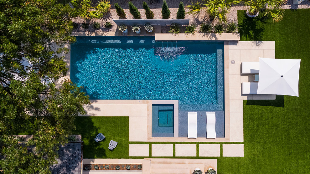 Mid-sized modern backyard rectangular pool in Dallas with a hot tub.